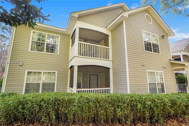 view of front of house featuring a balcony