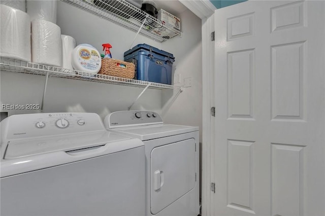 washroom featuring washer and clothes dryer