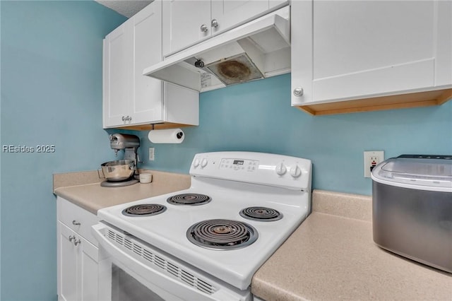 kitchen with white cabinetry and white electric range oven