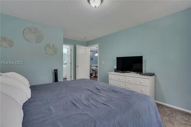 carpeted bedroom with a textured ceiling