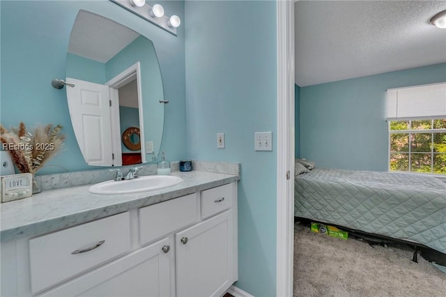 bathroom featuring vanity and a textured ceiling