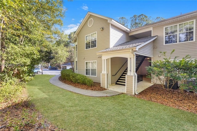 view of home's exterior with a lawn