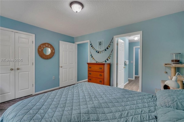 bedroom featuring a closet and a textured ceiling