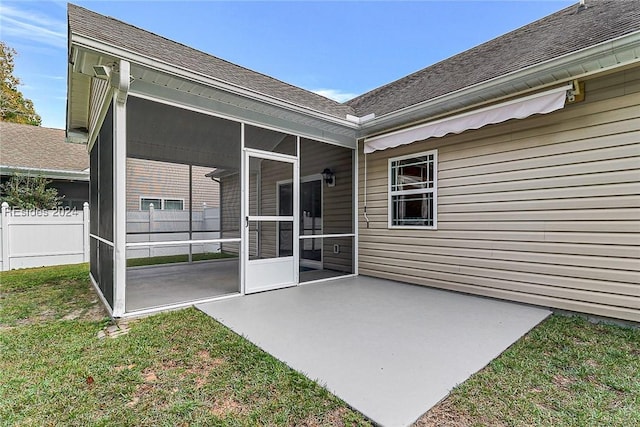 view of patio with a sunroom