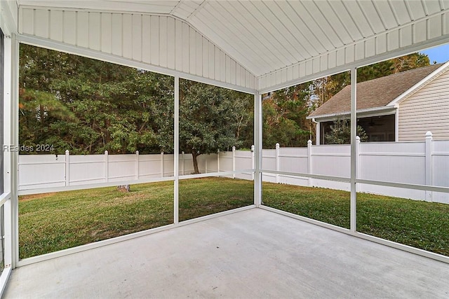 unfurnished sunroom with vaulted ceiling