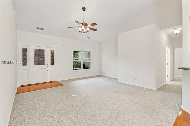 interior space featuring ceiling fan and lofted ceiling