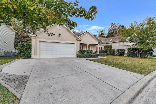 ranch-style home featuring a garage, central AC, and a front yard