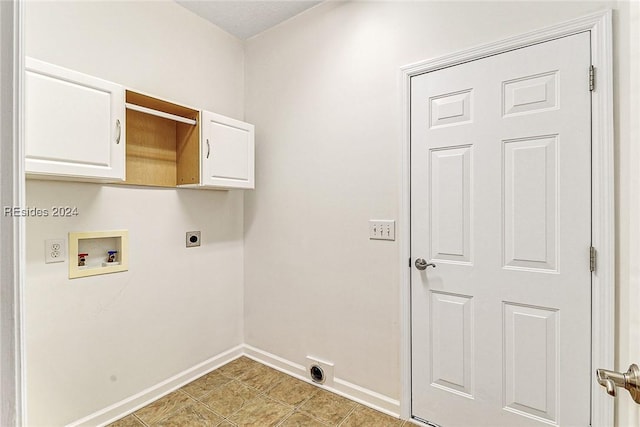 laundry room featuring cabinets, hookup for a washing machine, and electric dryer hookup