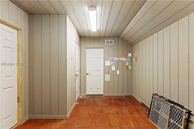 hallway with lofted ceiling