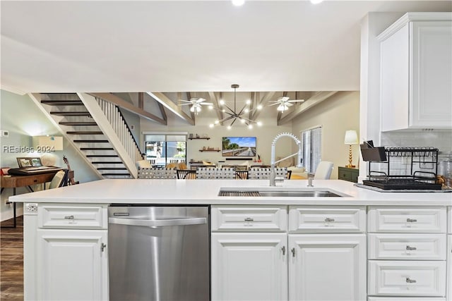 kitchen with dishwasher, sink, hanging light fixtures, and white cabinets