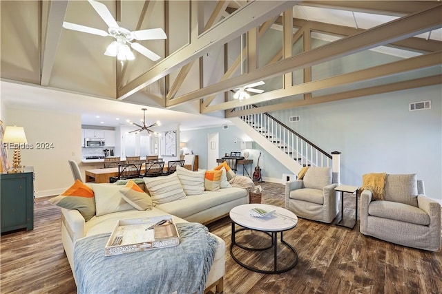 living room featuring ceiling fan with notable chandelier, high vaulted ceiling, and hardwood / wood-style flooring