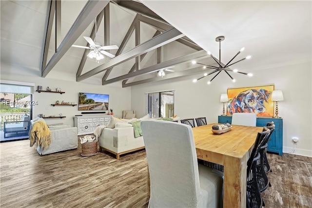 dining space with beam ceiling, plenty of natural light, and wood-type flooring