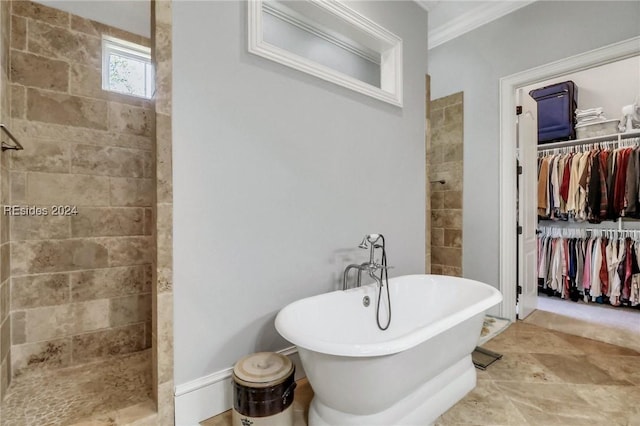 bathroom with ornamental molding and independent shower and bath