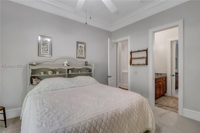 bedroom with ornamental molding, light colored carpet, ceiling fan, and ensuite bath