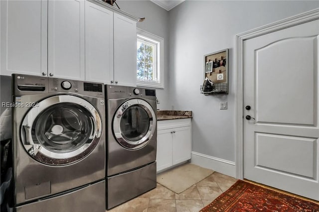 laundry room with washer and dryer, light tile patterned floors, crown molding, and cabinets