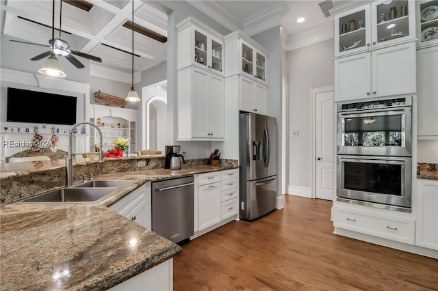 kitchen featuring coffered ceiling, sink, pendant lighting, appliances with stainless steel finishes, and beamed ceiling