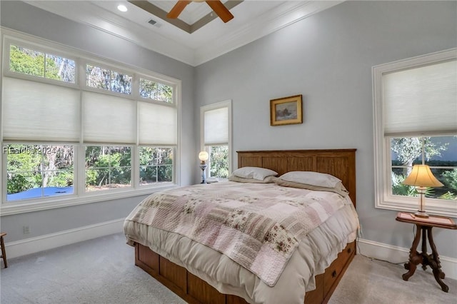 carpeted bedroom featuring ornamental molding and ceiling fan