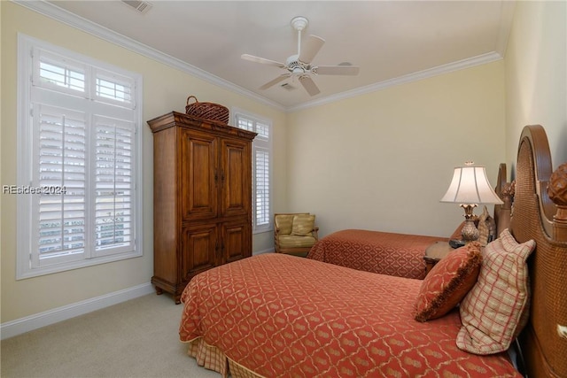 carpeted bedroom featuring ornamental molding and ceiling fan