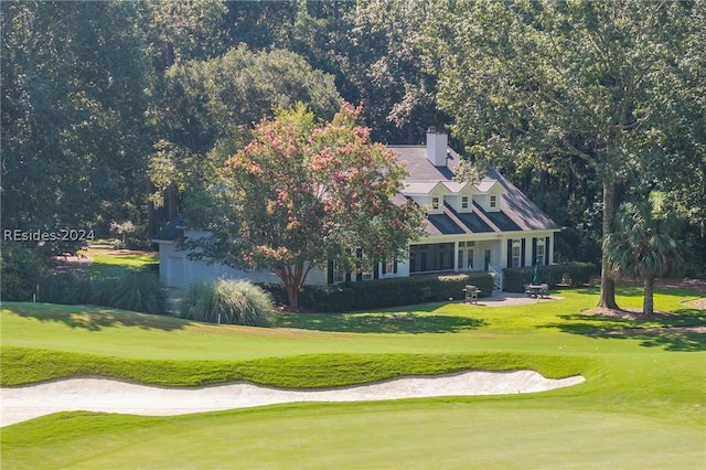 surrounding community featuring a lawn