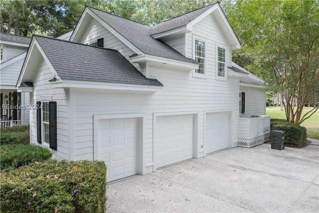 view of side of property featuring a garage