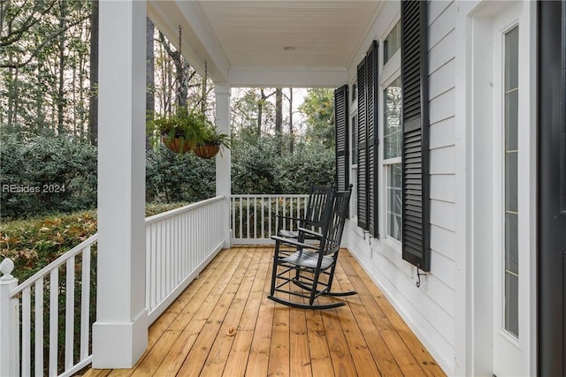 wooden deck featuring covered porch