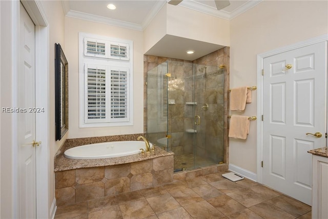 bathroom featuring ornamental molding and separate shower and tub