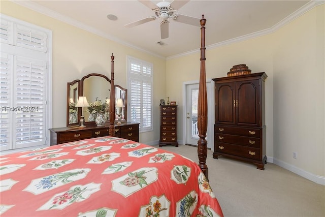 carpeted bedroom featuring ornamental molding and ceiling fan