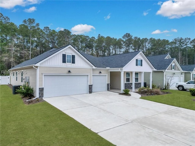 view of front of home with a garage and a front lawn