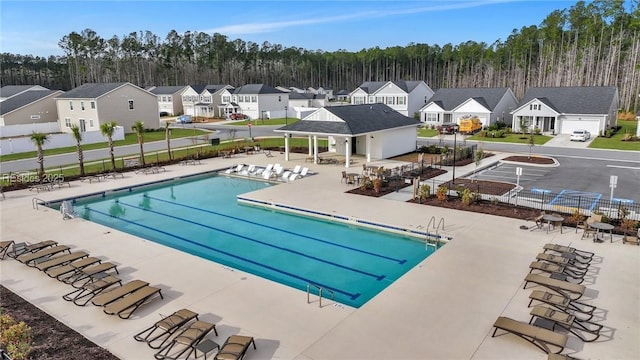 view of swimming pool with a patio