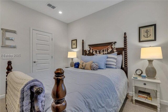 bedroom featuring light carpet