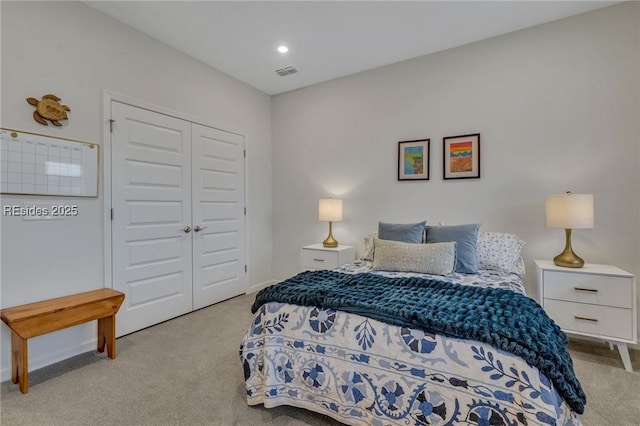 carpeted bedroom featuring a closet