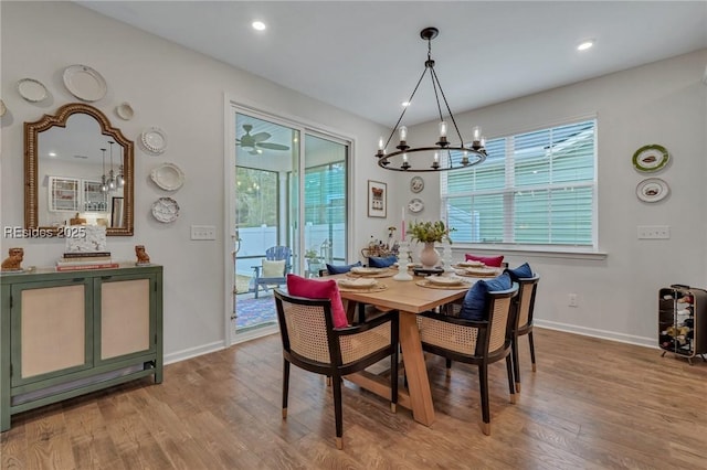 dining room with a chandelier and light wood-type flooring