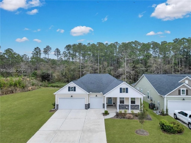 view of front of home with a porch, a garage, and a front yard