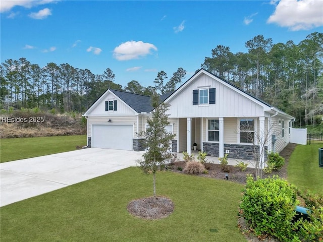 view of front of property with a garage, a porch, central AC, and a front lawn