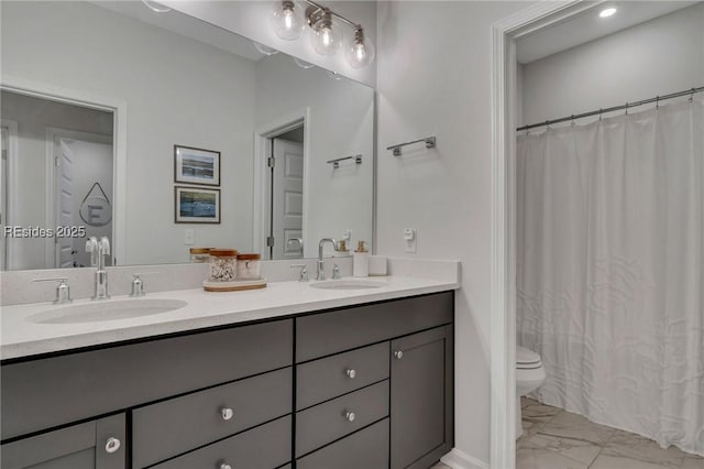 bathroom with vanity, toilet, and a shower with shower curtain