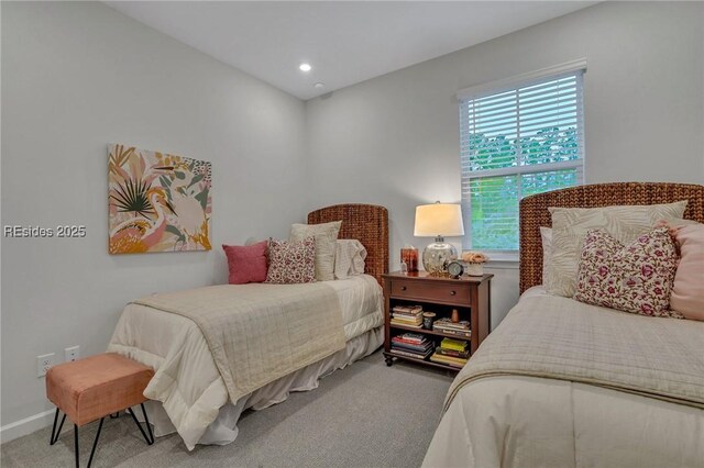 bedroom featuring light carpet