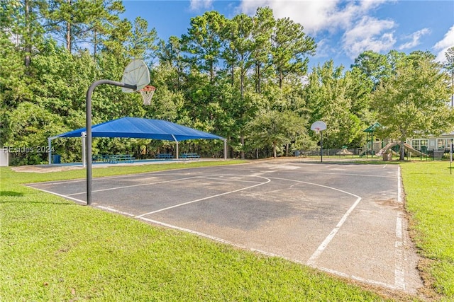 view of basketball court featuring a yard, a playground, and a gazebo