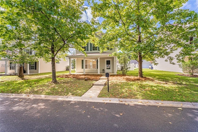 view of front of house featuring a porch and a front yard