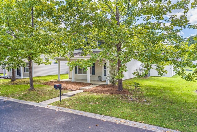 obstructed view of property featuring a front yard