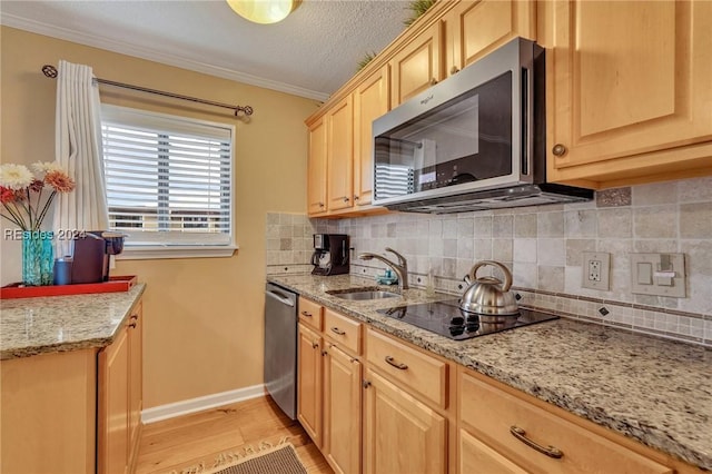 kitchen with crown molding, stainless steel appliances, light stone countertops, light hardwood / wood-style floors, and light brown cabinetry