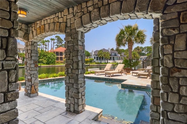 view of swimming pool featuring a patio area