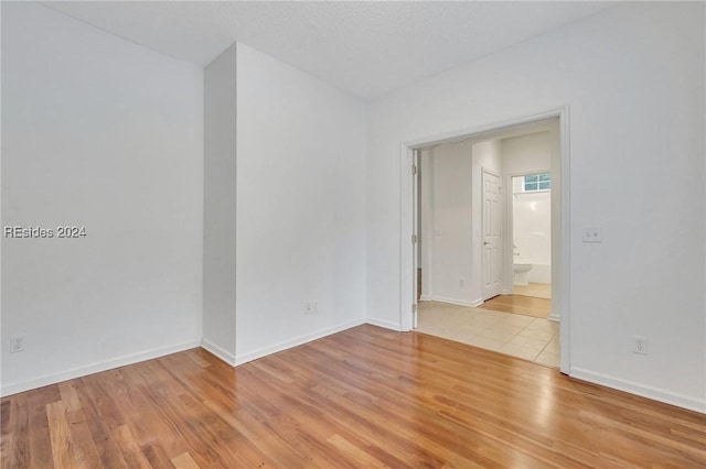 empty room with light hardwood / wood-style floors