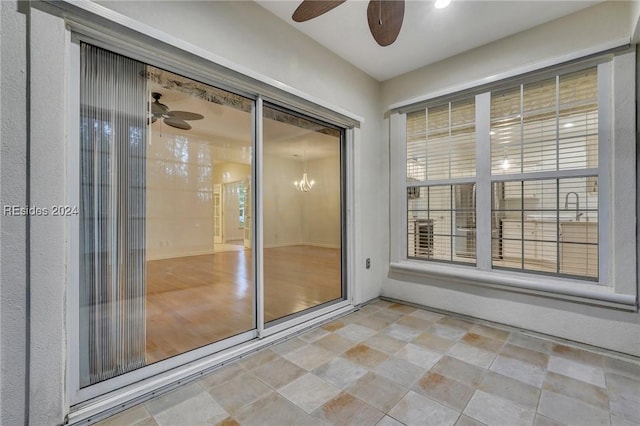 interior space with ceiling fan