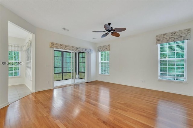 spare room with light hardwood / wood-style flooring and ceiling fan