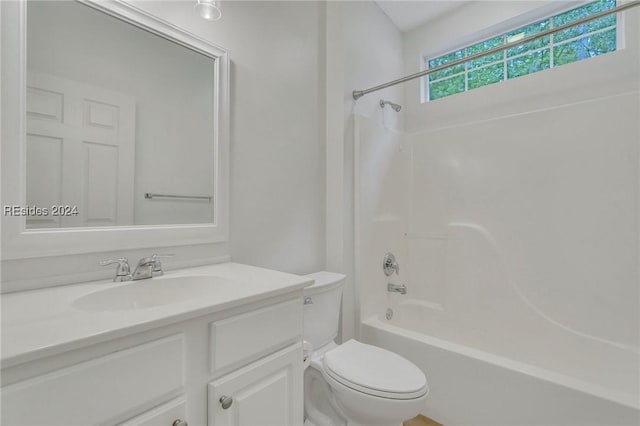 full bathroom featuring shower / bath combination, vanity, and toilet