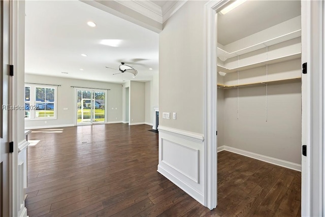 hall featuring crown molding and dark hardwood / wood-style floors