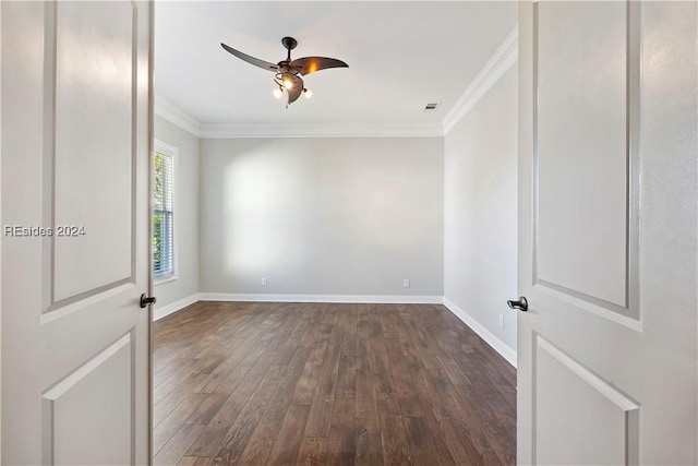 unfurnished room with ornamental molding, dark wood-type flooring, and ceiling fan