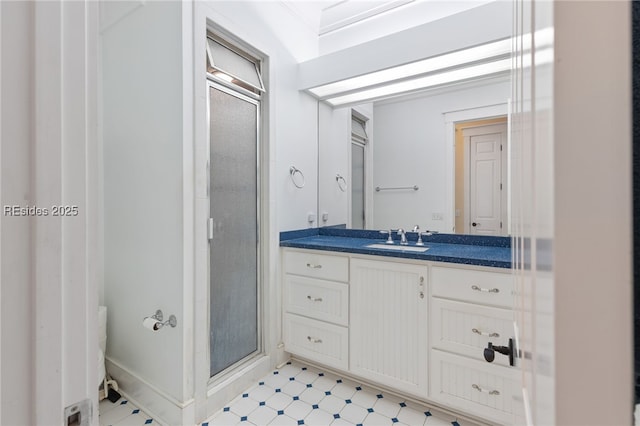 bathroom featuring walk in shower and vanity