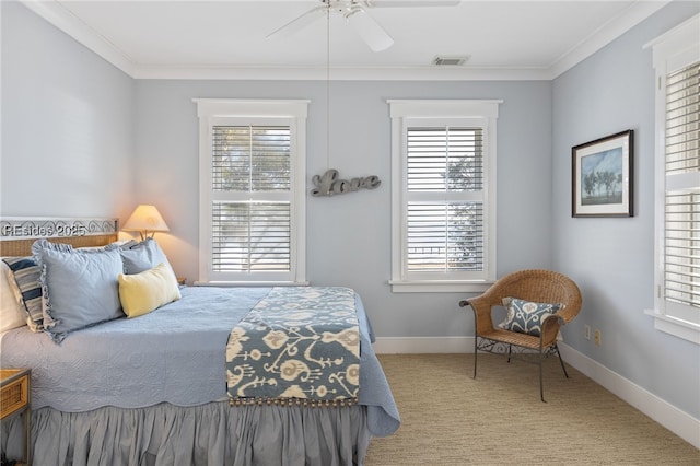 bedroom with crown molding, light colored carpet, and ceiling fan