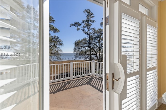 balcony featuring a water view